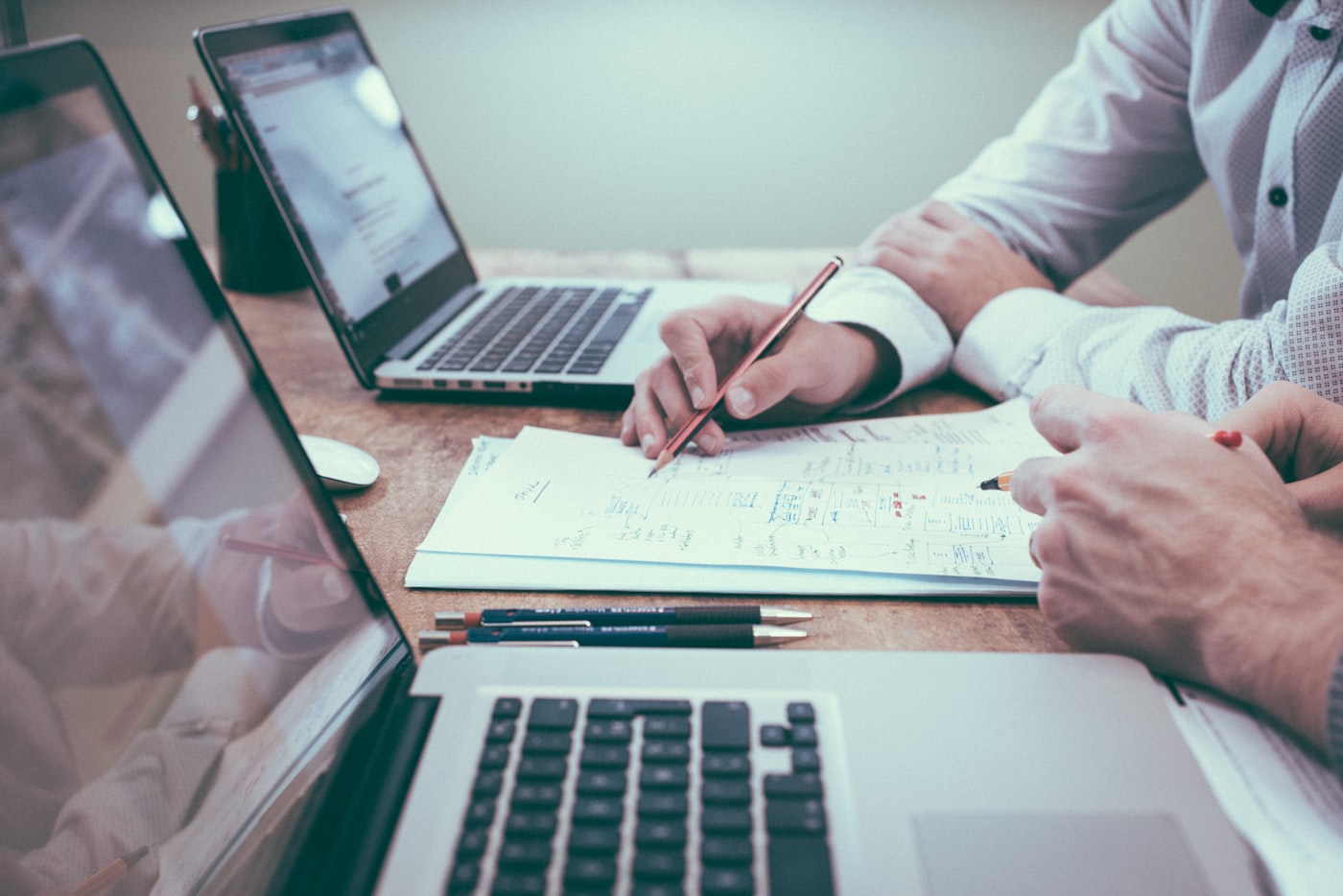 Professionals reviewing documents at a table